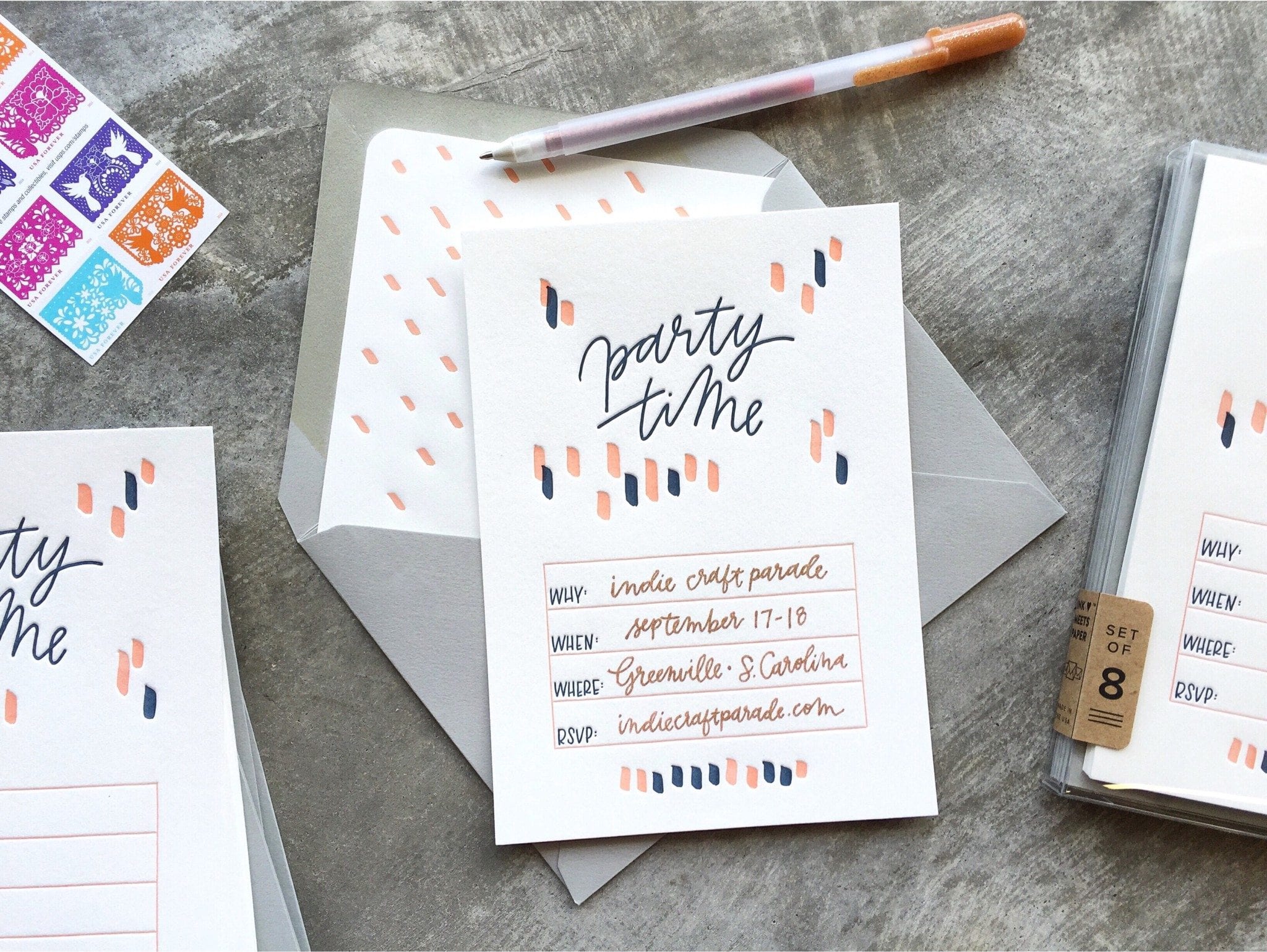 Styled shot showing Party Time Invitation with open envelope and exposed liner detail.