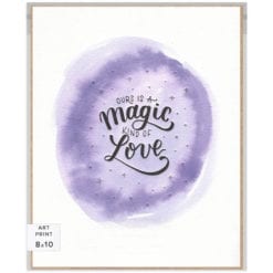 Handlettered words "Ours is a magic kind of love" letterpress-printed in black with silver-printed stars on a unique purple watercolor background