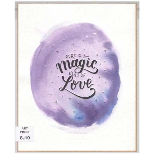 Handlettered words "Ours is a magic kind of love" letterpress-printed in black with silver-printed stars on a unique purple watercolor background