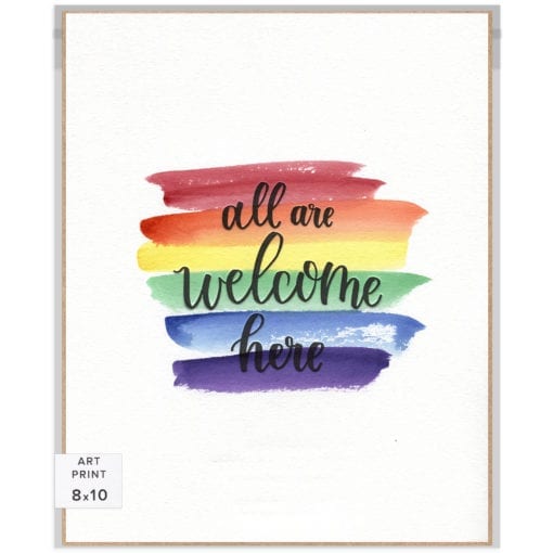 8x10 art print. Handlettered words "All Are Welcome Here" over a unique watercolor rainbow background