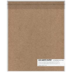 Chipboard backing sealed in clear sleeve with product label in bottom-right corner